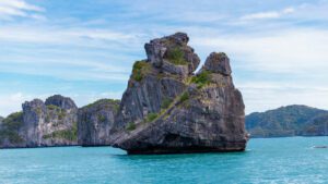 A large rock formation in the sea.