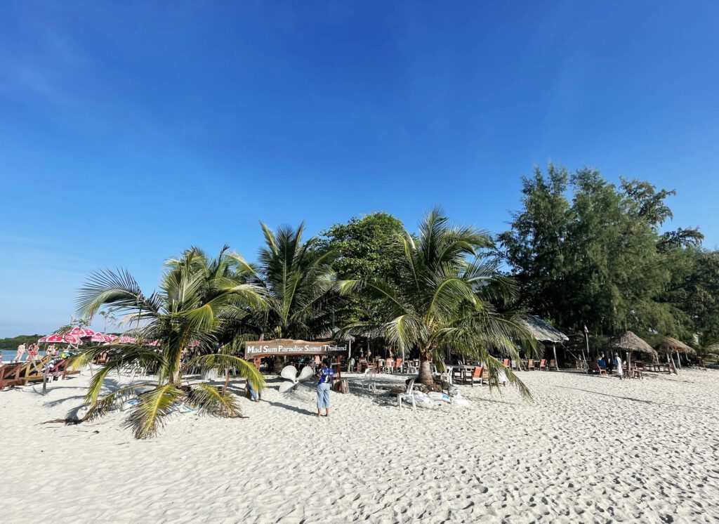 Koh Mad Sum beach surrounded by palm trees