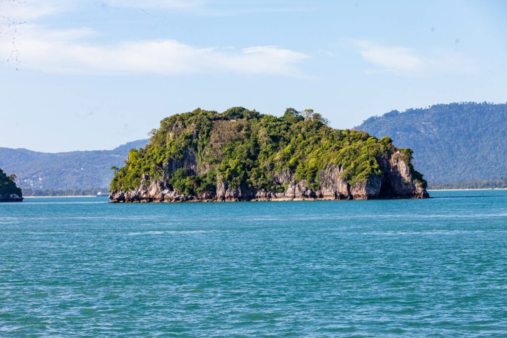 A large island standing next to Koh Samui
